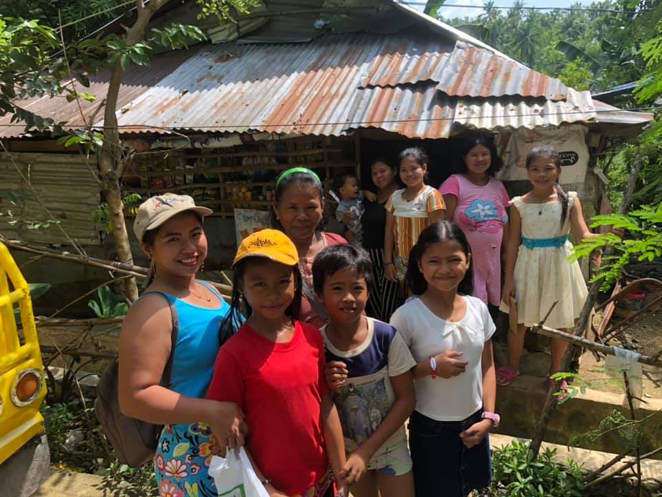 A hand holding a sapling